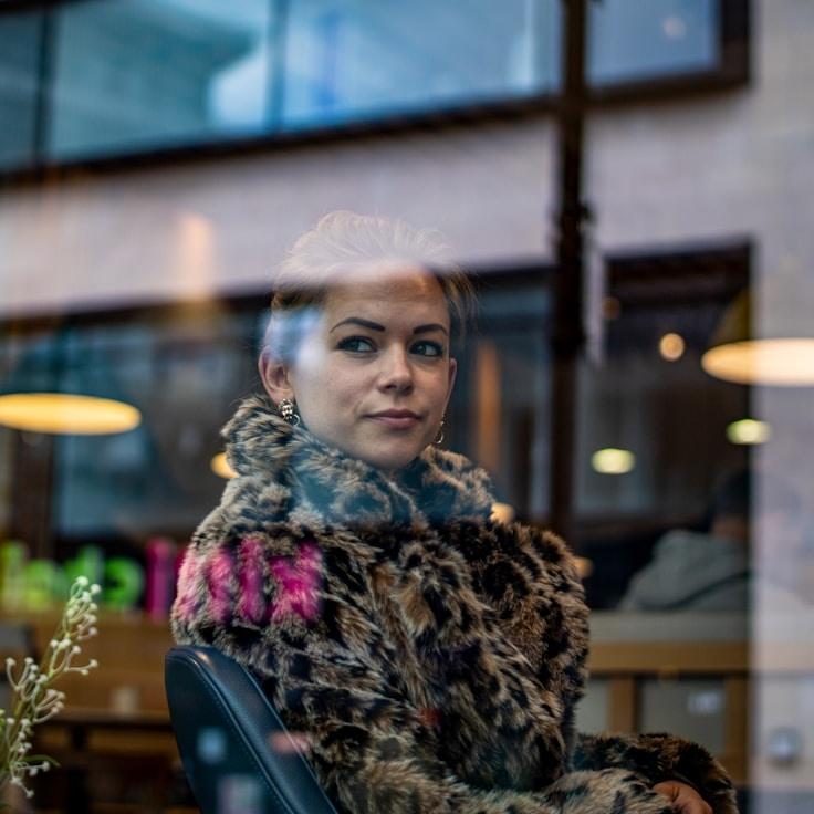 Kaveri Mehta, Lead Design Curator at Silver Peak Network, reviewing corporate floral arrangements